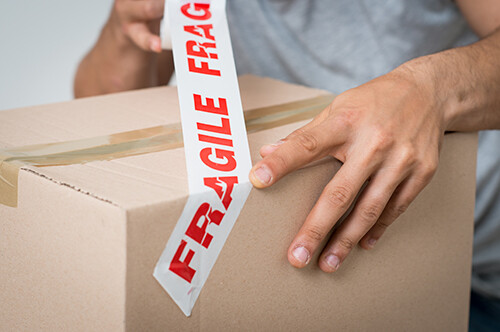Wrapping Fragile Tape Around A Parcel